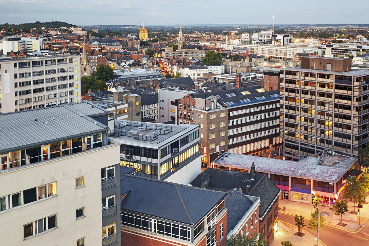 An elevated view of the roof tops of Nottingham city centre. Photograph taken at dusk.