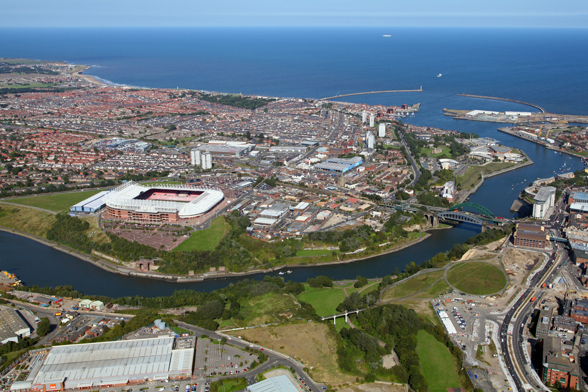 An aerial photograph of the city of Sunderland in the county of Tyne and Wear. The River Tyne is seen flowing through the city and out to sea.
